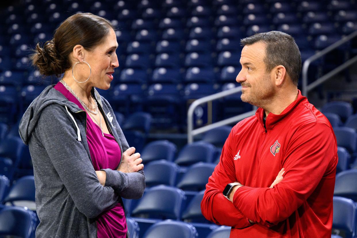 Louisville coach Jeff Walz talks with ESPN analyst Rebecca Lobo before a game against Notre Dame on Feb. 16, 2023, in South Bend, Ind.