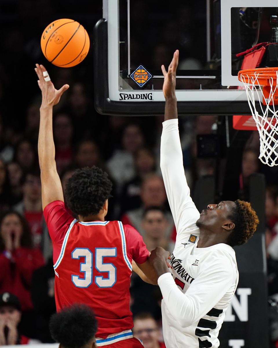 Bradley Braves forward Darius Hannah (35) takes a shot as Cincinnati Bearcats forward Aziz Bandaogo (55) defends in the first half of a college basketball game during a second-round game of the National Invitation Tournament,, Saturday, March 23, 2024, at Fifth Third Arena in Cincinnati.