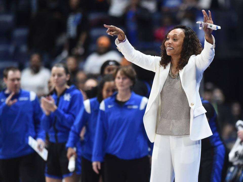 Kentucky women's basketball coach Kyra Elzy sends out directions to her player during the SEC women's basketball championship game against South Carolina in Nashville, Tenn. on Sunday, March 6, 2022. 