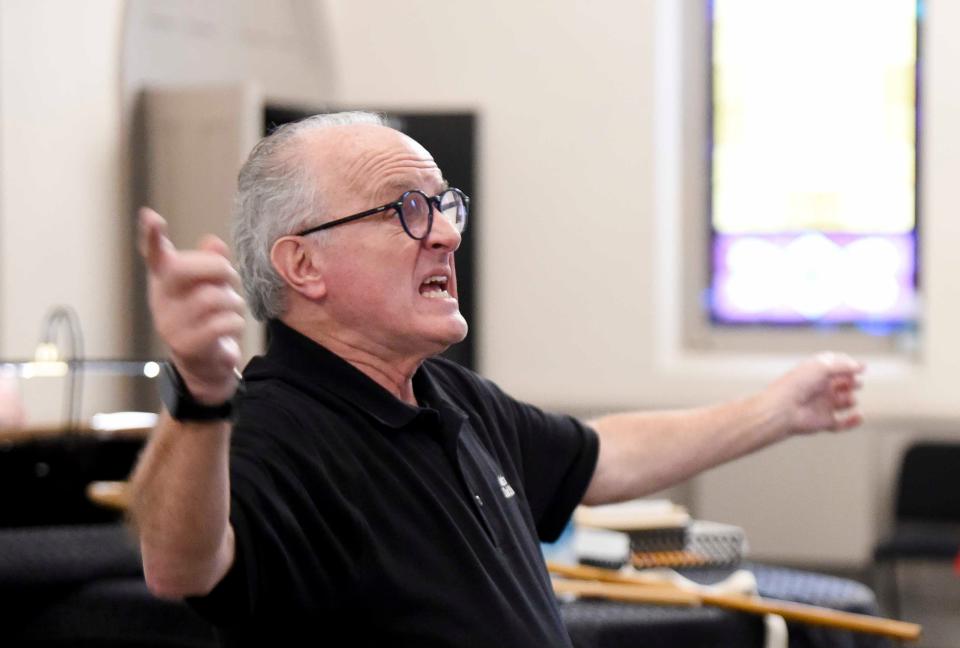 April 17, 2024; Tuscaloosa, AL, USA; Doff Procter and his wife Laurel are retiring from directing the Alabama Choir School. Procter conducts a song during rehearsal at Christ Episcopal Church.