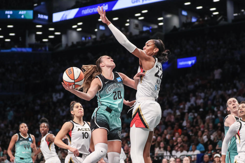 New York Liberty guard Sabrina Ionescu goes up against Las Vegas Aces forward A'ja Wilson in the first quarter at Barclays Center in New York on Aug. 6, 2023. (Wendell Cruz/USA TODAY Sports)