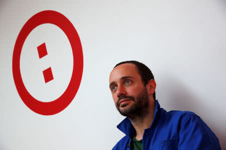 Raphael Roig, territorial development officer at Simplon.co, poses after an interview with Reuters at the Simplon school specialized in digital sector in Montreuil, near Paris, France, June 14, 2018. Picture taken June 14, 2018. REUTERS/Philippe Wojazer