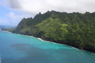 CORRECTS TO DELETE THE REFERENCE OF THE DATE OF THE PHOTO TAKEN AS THE CREATION DATE IS UNKNOWN - This undated photo provided by the Hawaii Department of Land and Natural Resources shows an area over Na Pali Coast State Wilderness Park. There were no survivors of Thursday's Hawaii tour helicopter crash that killed a few minors and several adults, officials confirmed Saturday, Dec. 28, 2019. (Dan Dennison/Hawaii DLNR via AP)