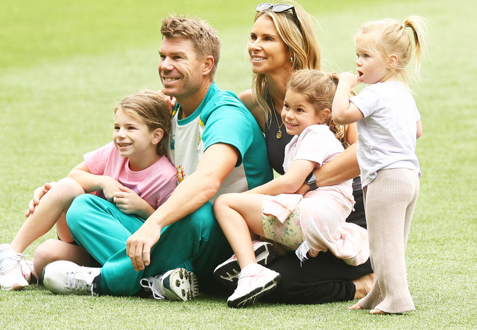 David Warner, pictured here with wife Candice and their daughters at the MCG in 2021.