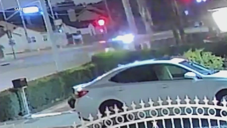 Surveillance video shows the victims’ vehicle enter the intersection when alleged DUI driver Victor Siharath runs a red light. (KTLA)