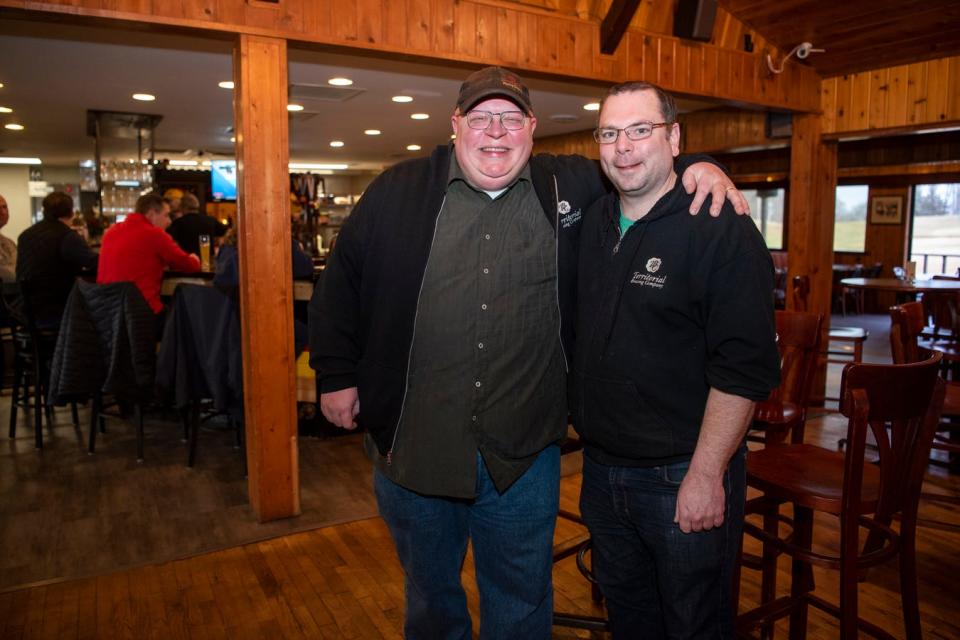 In this Dec. 17, 2019 photo, Tim Davis and Charles Grantier, owners of Territorial Brewing Co. in Springfield, Mich.