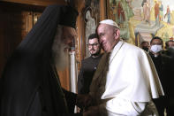 Pope Francis meets Archbishop of Athens and leader of Greece's Orthodox Church, Ieronymos II at the Orthodox archbishopric in Athens, Greece, Saturday, Dec. 04, 2021. On the second leg of a five-day visit to Cyprus and Greece, aimed at bolstering recently mended ties between the Vatican and Greek Orthodox churches, Francis is set to hold meetings about an emerging alliance between the eastern and western branches of Christianity to respond to climate change and other major global problems. (George Vitsaras/Pool Photo via AP)