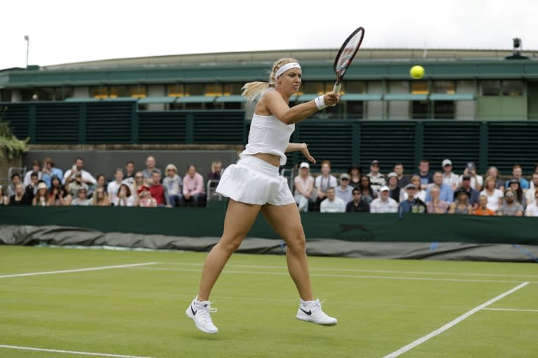 Germany's Sabine Lisicki returns against US player Shelby Rogers during their women's singles first round match on the first day of the 2016 Wimbledon Championships at The All England Lawn Tennis Club in Wimbledon, southwest London, on June 27, 2016