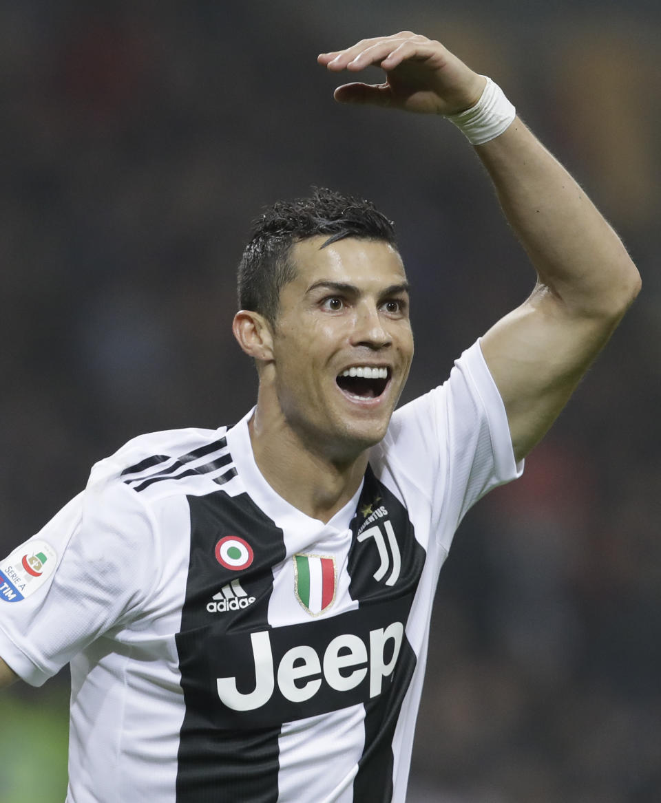 Juventus' Cristiano Ronaldo celebrates after he scored his side's second goal during a Serie A soccer match between AC Milan and Juventus, at Milan's San Siro stadium, Sunday, Nov. 11, 2018. (AP Photo/Luca Bruno)