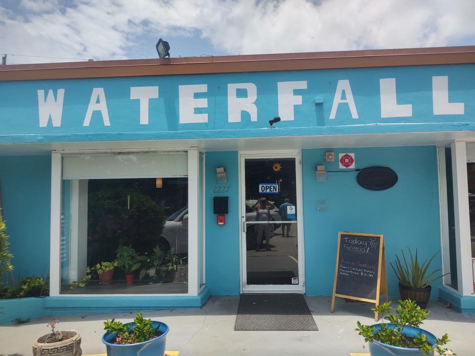 Waterfall Restaurant in Vero Beach has an eye-catching turquoise exterior set back off 14th Avenue with a parking lot in front.