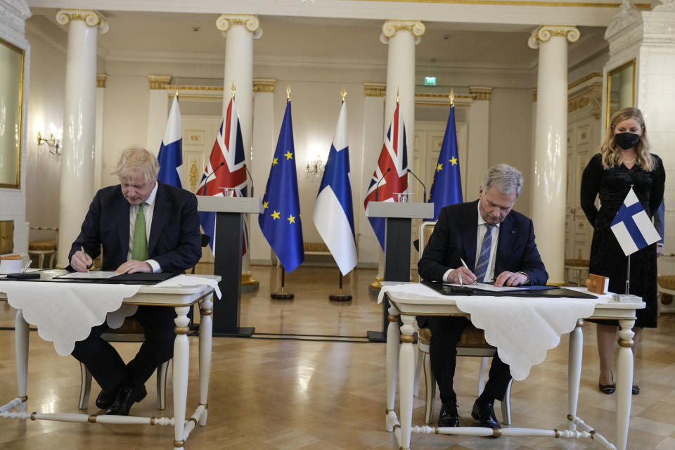 FILE - British Prime Minister Boris Johnson, left, and Finland's President Sauli Niinisto sign a security assurance, at the Presidential Palace in Helsinki, Finland, Wednesday, May 11, 2022. Finland appears on the cusp of joining NATO. Sweden could follow suit. By year’s end, they could stand among the alliance’s ranks. Russia’s war in Ukraine has provoked a public about face on membership in the two Nordic countries. They are already NATO’s closest partners, but should Russia respond to their membership moves they might soon need the organization’s military support. (AP Photo/Frank Augstein, Pool, File)