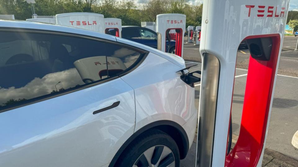 Supercharger charging stations for Tesla electric vehicles is seen at a service station.