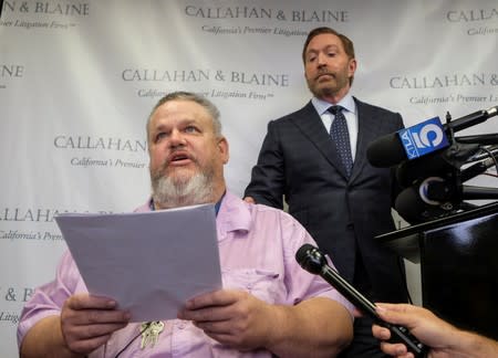 Geoffrey Johnson and his attorney Daniel J. Callahan speak in a news conference announcing a lawsuit against his former lawyer Michael Avenatti over a 4 million dollar settlement with the County of Los Angeles in Santa Ana