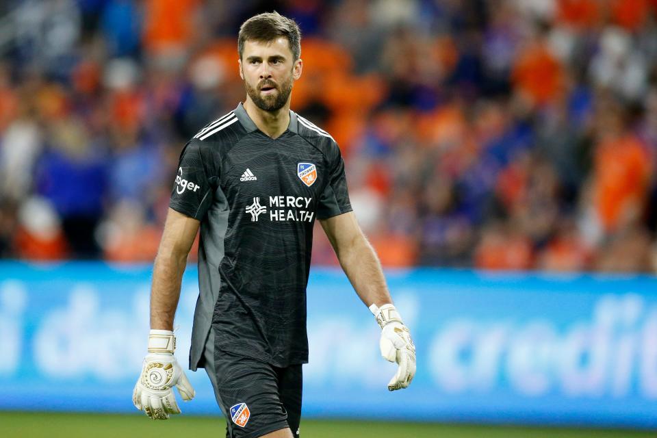 FC Cincinnati goalkeeper Alec Kann (1) walks back to the goal after giving up the go-ahead point in the second half of the MLS soccer match between the FC Cincinnati and the D.C. United at TQL Stadium in Cincinnati on Saturday, March 5, 2022. D.C. United won the match, 1-0, on a stoppage time penalty kick goal. 