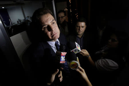 Salvador Nasralla, presidential candidate of the Opposition Alliance Against the Dictatorship, talks to reporters while leaving a meeting with businessmen in Tegucigalpa, Honduras, December 5, 2017. REUTERS/Jorge Cabrera