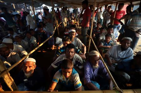 Rohingya refugees line up to receive humanitarian aid in Balukhali refugee camp near Cox's Bazar, Bangladesh, October 26, 2017. REUTERS/Hannah McKay