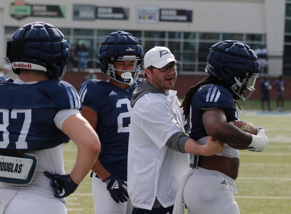 Georgia Southern defensive coordinator Brandon Bailey demonstrates a drill while working with the defense during Spring practice on Thursday April 6, 2023. Credit: Richard Burkhart/Savannah Morning News-USA TODAY NETWORK