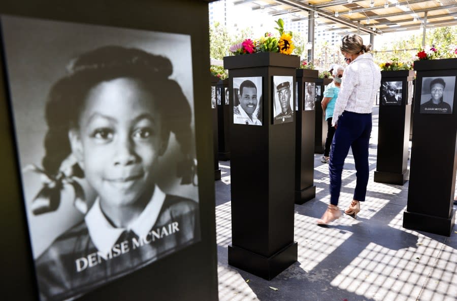 A visitor views the Say Their Names memorial exhibit at Martin Luther King Jr. Promenade on July 20, 2021 in San Diego, California. The traveling memorial is sponsored by the San Diego African American Museum of Fine Art (SDAAMFA) and features photographs of 200 Black Americans who lost their lives due to systemic racism and racial injustice. 11-year-old Denise McNair was one of four Black girls killed in the KKK bombing of the 16th Street Baptist Church in 1963 in Birmingham. (Photo by Mario Tama/Getty Images)