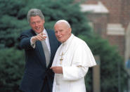 FILE - In this Aug. 12, 1993, file photo, President Bill Clinton points out people in the crowd to Pope John Paul II as he arrives in Denver, Colo. President Joe Biden is scheduled to meet with Pope Francis on Friday, Oct. 29, 2021. Biden is only the second Catholic president in U.S. history. (AP Photo/Bruno Musconi, File)