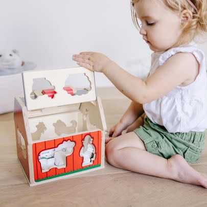 Save 25% on this Melissa & Doug wooden Barnyard Tumble toy.