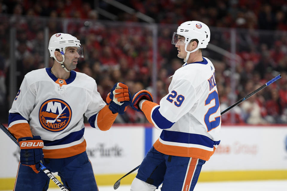 New York Islanders center Brock Nelson (29) celebrates his goal with defenseman Nick Leddy (2) during the first period of an NHL hockey game against the Washington Capitals, Tuesday, Dec. 31, 2019, in Washington. (AP Photo/Nick Wass)