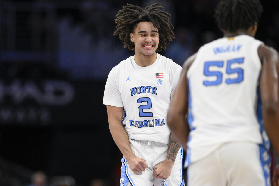 North Carolina guard Elliot Cadeau (2) celebrates during the first half of an NCAA college basketball game against Florida State in the quarterfinal round of the Atlantic Coast Conference tournament, Thursday, March 14, 2024, in Washington. (AP Photo/Nick Wass)