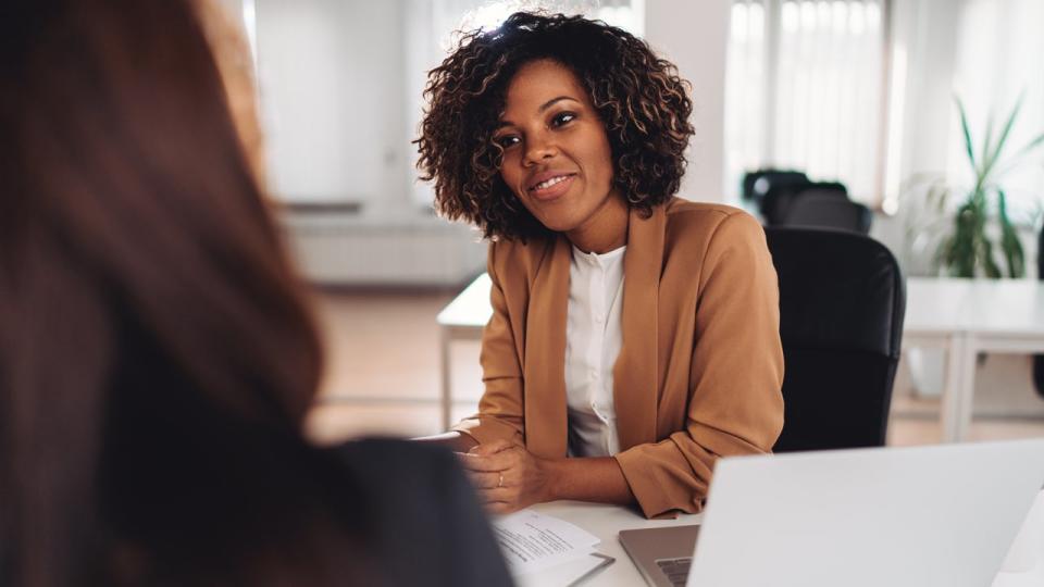 two women discussing finances