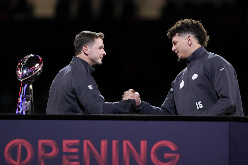 San Francisco 49ers quarterback Brock Purdy and Kansas City Chiefs quarterback Patrick Mahomes shake hands during NFL football Super Bowl 58 opening night Monday, Feb. 5, 2024, in Las Vegas. The San Francisco 49ers face the Kansas City Chiefs in Super Bowl 58 on Sunday. (AP Photo/Matt York)