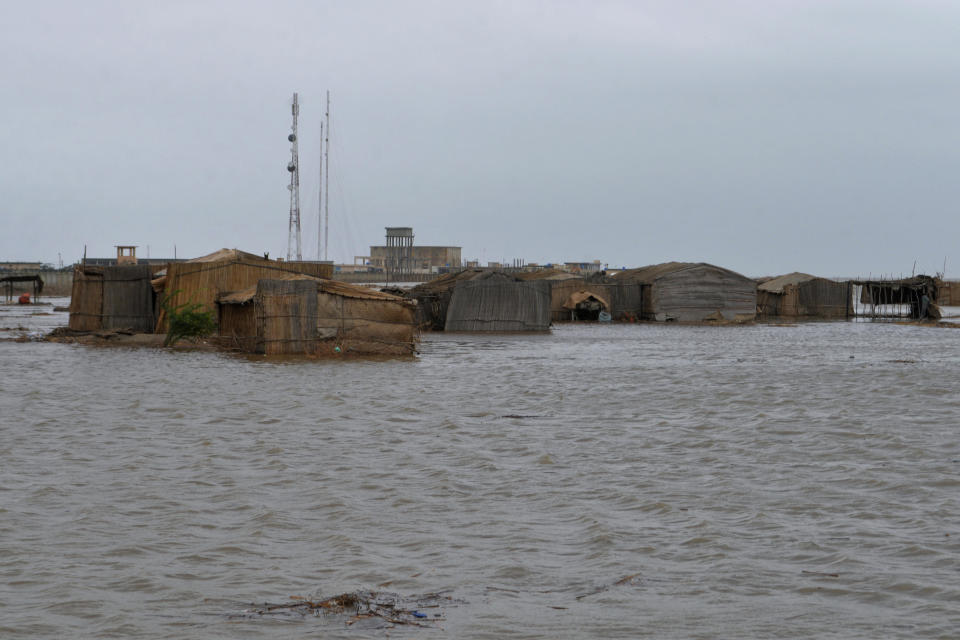 Huts submerged by heavy rain ahead of Cyclone Biparjoy's landfall are seen in a costal village in Shah Bandar, near Thatta, in Pakistan's southern Sindh province, June 15, 2023. / Credit: Umair Rajput/AP