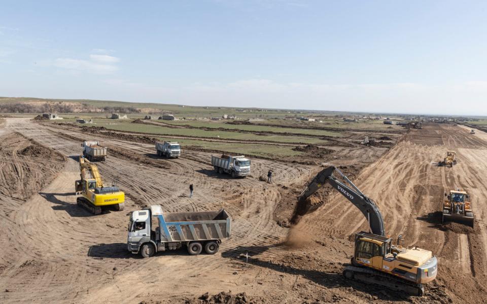 Bulldozers smooth what will become the runway at a new airport near the destroyed town of Fuzuli, in Nagorno-Karabakh - Sam Tarling/Sam Tarling