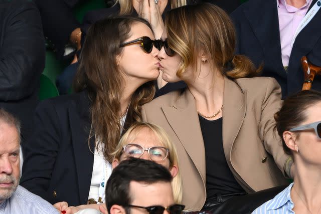 <p>Karwai Tang/WireImage</p> Minke and Cara Delevingne at Wimbledon