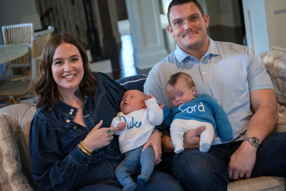 Emma Kelly, left, and her husband, Indianapolis Colts Center Ryan Kelly, sit with their new sons Duke, left, and Ford, Thursday, Nov. 16, 2023 in their home. The Kellys' first child, Mary Kate, died in Dec. 2021. She was delivered at 19.5 weeks.
