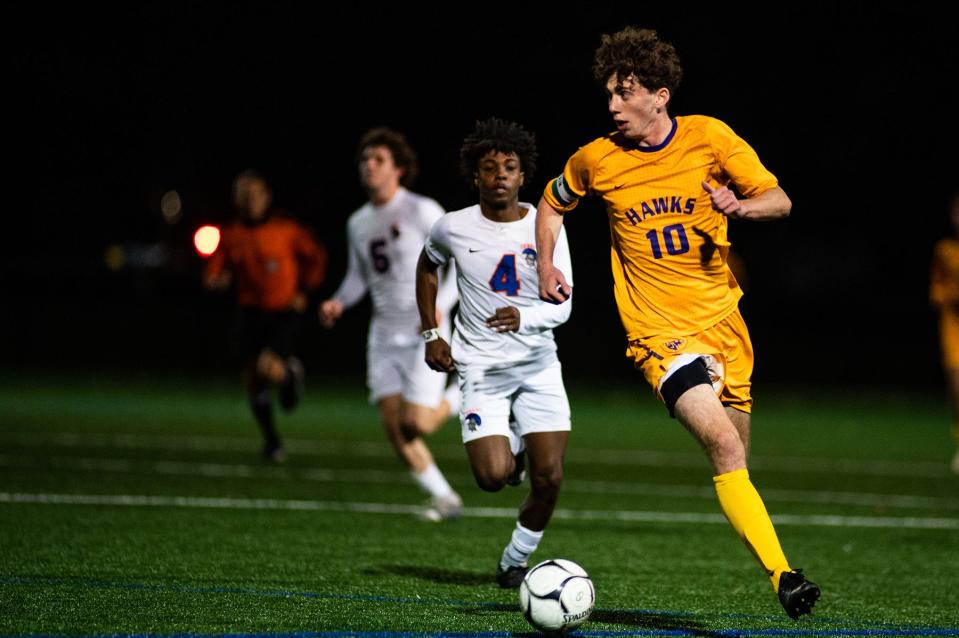 Rhinbeck's Aidan Prezzano runs with the ball during the Section 9 Class C semifinal soccer game at Bard College in Annandale-On-Hudson on Saturday, October 22, 2022.