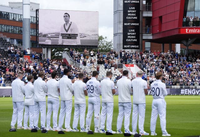 England players stand during a tribute to Graham Thorpe