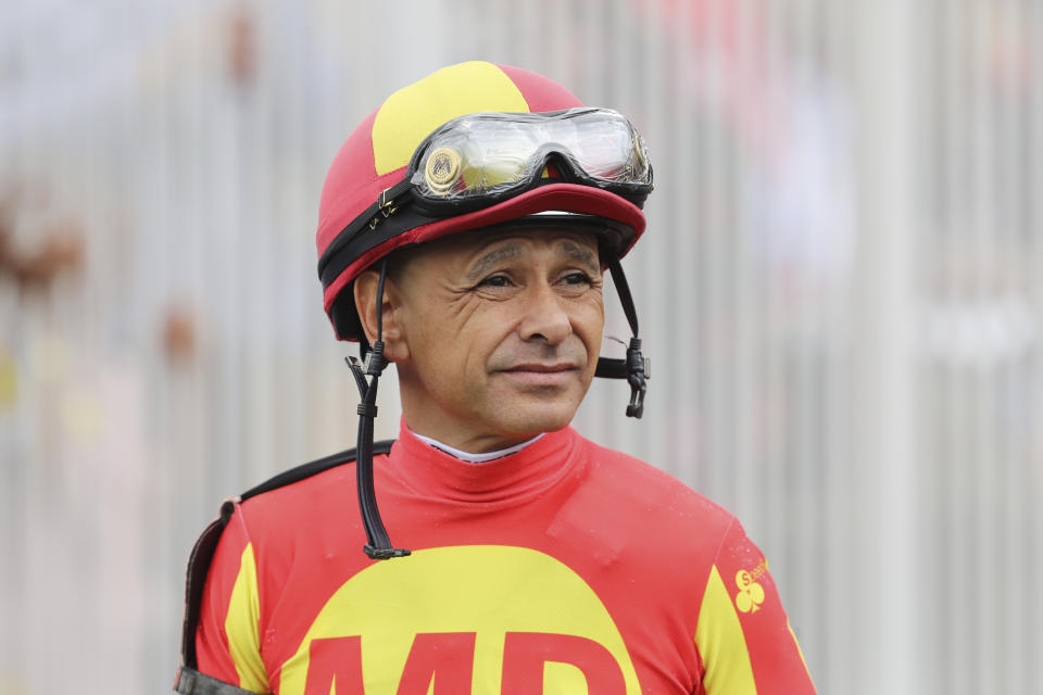 FILE - Jockey Mike Smith looks on before a horse race at Churchill Downs in Louisville, Ky., May 3, 2019. Many in the crowd that packed Churchill Downs for last year’s Kentucky Derby left in tears and questioning the safety of horse racing after two horses died that day. “You can’t ever be too safe when it comes to our sport,” two-time Derby-winning jockey Mike Smith said. (AP Photo/Gregory Payan, File)