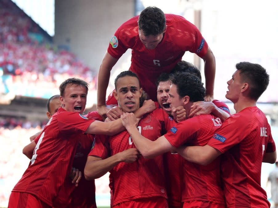 Denmark celebrate Yussuf Poulsen’s goal (POOL/AFP via Getty Images)