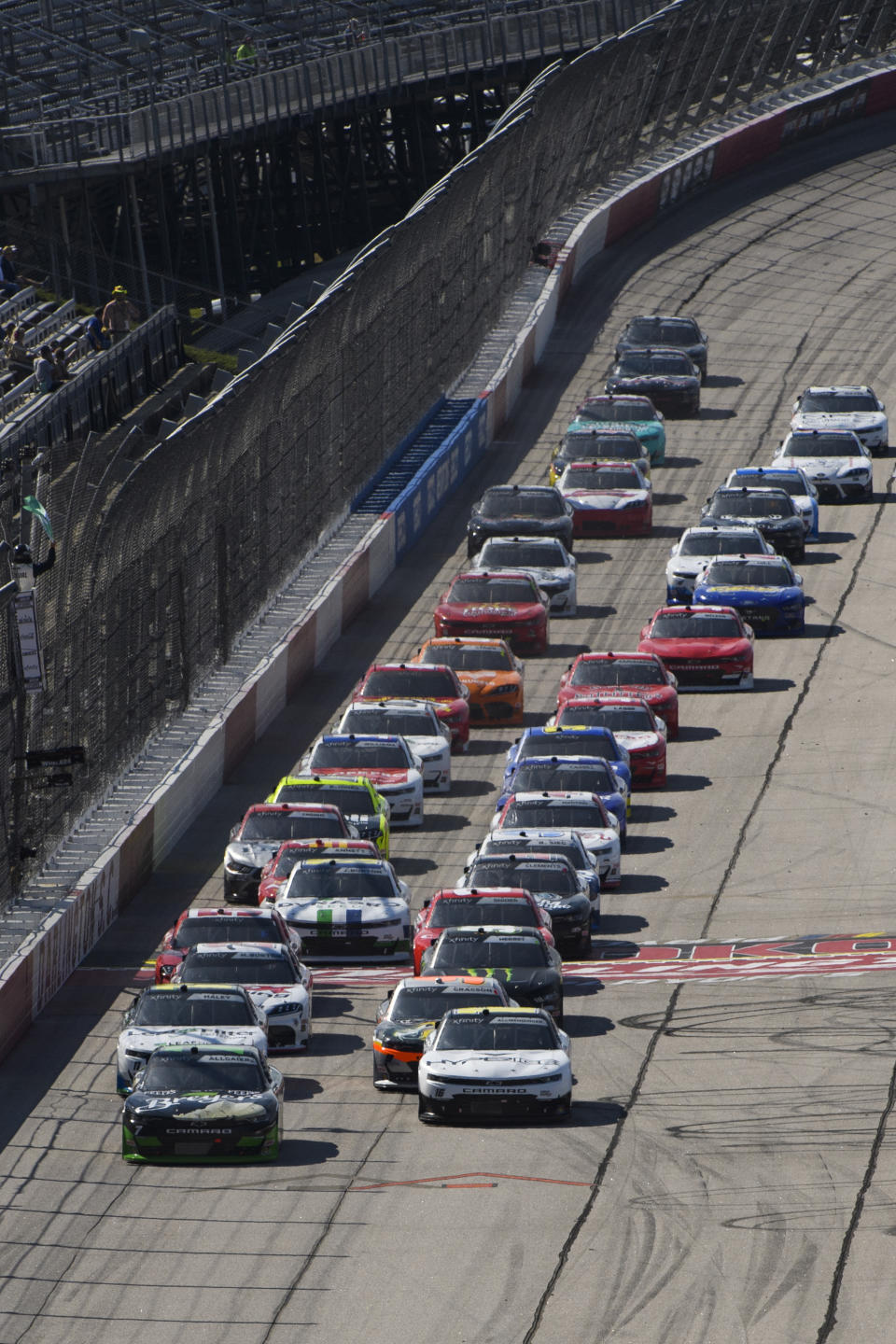 Justin Allgaier, left, and AJ Allmendinger, right, lead as cars are released from the first yellow flag of a NASCAR Xfinity Series auto race Saturday, Sept. 4, 2021, in Darlington, S.C. (AP Photo/John Amis)