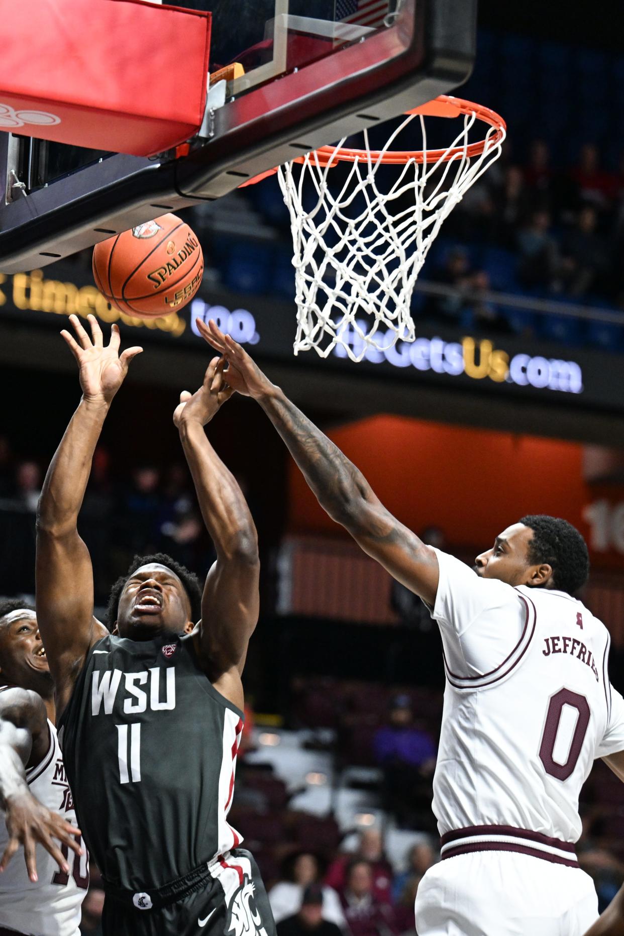 Nov 18, 2023; Uncasville, CT, USA; Washington State Cougars guard Joseph Yesufu (11) has his shot blocked by Mississippi State Bulldogs forward D.J. Jeffries (0) during the first half at Mohegan Sun Arena. Mandatory Credit: Mark Smith-USA TODAY Sports