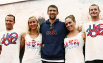 Jul 25, 2012; London, United Kingdom; USA swimmers Brendan Hensen and Jessica Hardy and Michael Phelps and Natalie Coughlin and Tyler Clary pose for a photograph during a press conference at Speedo Club at Forman's Fish Island. Mandatory Credit: Rob Schumacher-USA TODAY Sports