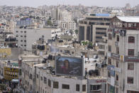 An outdoor screen shows a picture of Al Jazeera journalist Shireen Abu Akleh and Arabic that reads, "goodbye Shireen, the voice of Palestine," at the center of the West Bank city of Ramallah, Wednesday, May 11, 2022. Abu Akleh was shot and killed while covering an Israeli raid in the occupied West Bank town of Jenin early Wednesday. (AP Photo/Nasser Nasser)