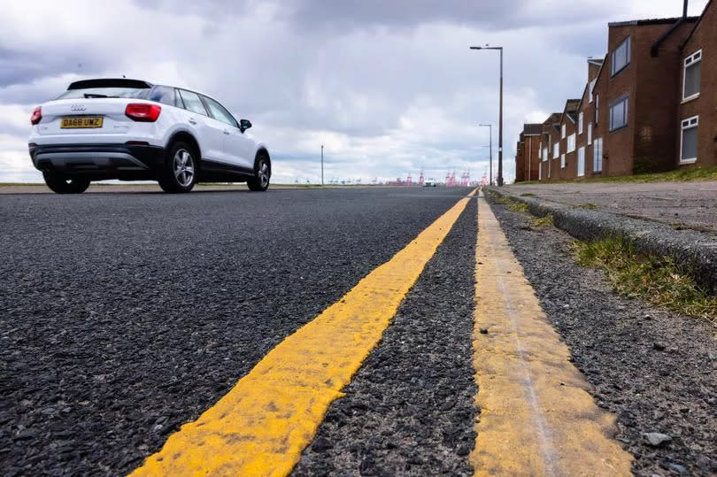 New double yellow road markings on Coastal Drive in New Brighton