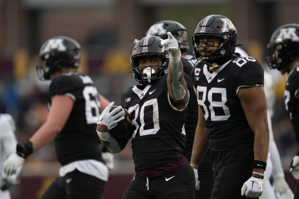 Minnesota running back Jordan Nubin (30) signals for a first down during the second half of an NCAA college football game against Michigan State, Saturday, Oct. 28, 2023, in Minneapolis. (AP Photo/Abbie Parr)