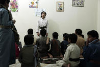 Boys recite poems during a session at a rehabilitation center for former child soldiers in Marib, Yemen, in this July 25, 2018, photo. The Houthi rebels have enlisted some 18,000 child fighters over the course of the 4-year-old civil war, according to one Houthi official. Their experiences in combat, including seeing bodies of the dead and charging into battle as missiles explode, have left many of the boys traumatized. (AP Photo/Nariman El-Mofty)