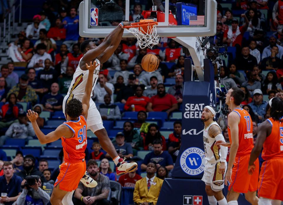 New Orleans Pelicans forward Zion Williamson (1) dunks over Oklahoma City Thunder forward Jeremiah Robinson-Earl in the first quarter of an NBA basketball game in New Orleans, Monday, Nov. 28, 2022. (AP Photo/Derick Hingle)