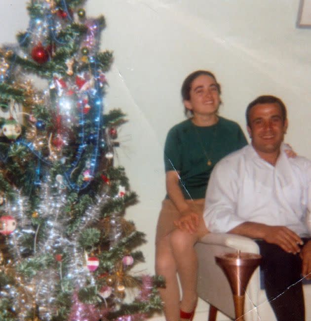 A photo of the author’s parents taken when they were dating. “My mom is approximately 20 years old and my dad is 27,” she writes. “They’re pictured at my mom’s parents’ house during the festive season. My dad’s holding a cigarette — he always loved smoking.”