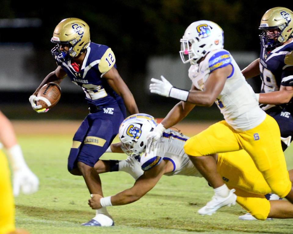 Central Catholic running back Joey Alcutt jets away from multiple defenders during a game between Central Catholic and Serra at Central Catholic High School in Modesto, California, on September 8, 2023.