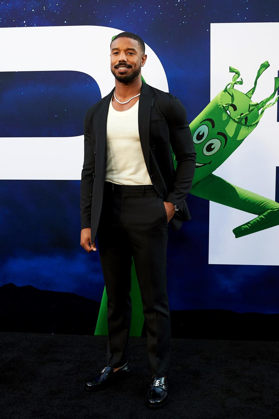 Michael B. Jordan posing for photos at the World Premiere Of Universal Pictures "Nope."
