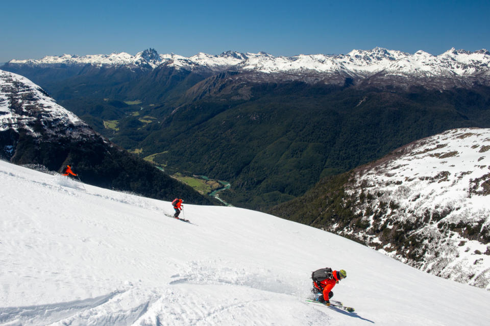 Skiers peer into the expansive valley below,<p>Photo: Courtesy of Eleven</p>