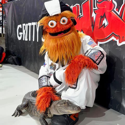 <p>Gritty/ Instagram</p> Philadelphia Flyers mascot Gritty pets Wally the emotional support alligator