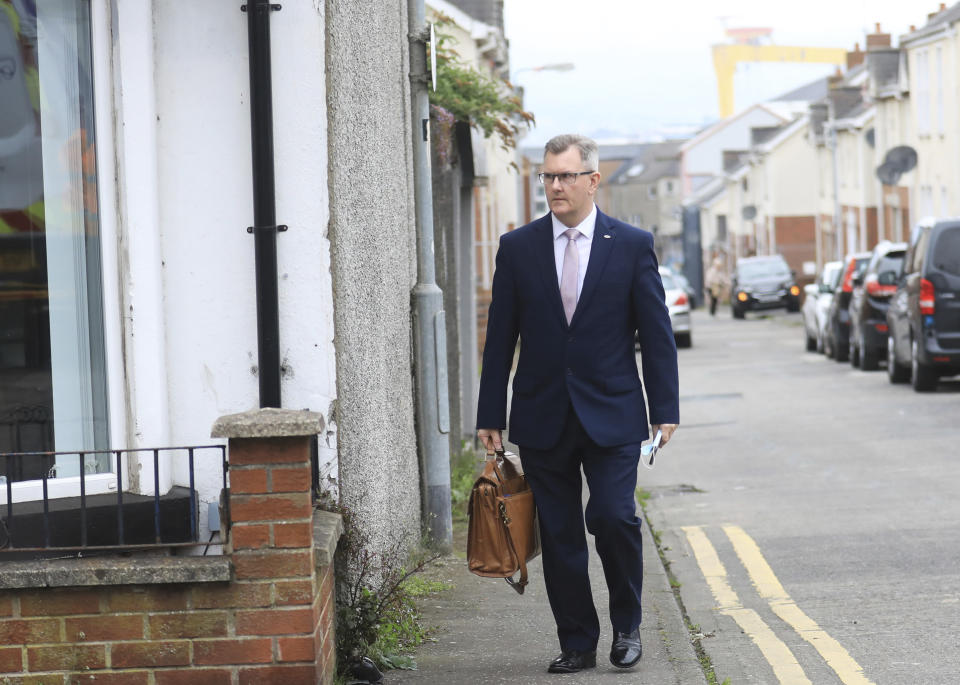 Democratic Unionist Party member Jeffrey Donaldson MP leaves the party headquarters in east Belfast after voting took place to elect a new leader on Friday May 14, 2021. Edwin Poots and Jeffrey Donaldson are running to replace Arlene Foster. (AP Photo/Peter Morrison)